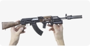 AKM 1959 miniature model with a silent & flameless device in hand