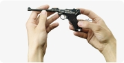 Artillery Luger Pistol, M1908 decorated miniature model in hand